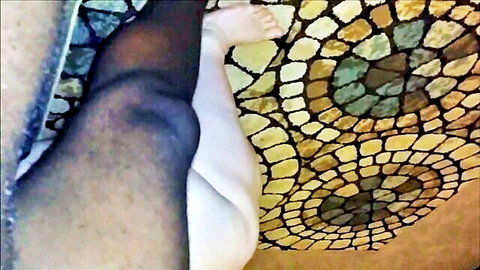 BBW woman's leg in black stockings, foot tease on tiled floor in amateur porn