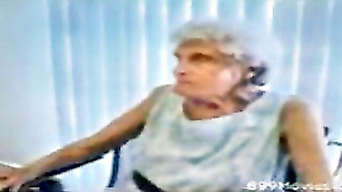 87-year-old granny in light sleeveless top, mature elderly woman portrait
