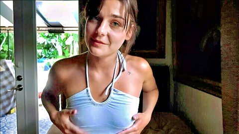 Arabella Rose teasing in sheer blue halter top, seductive pose