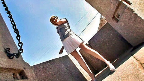 Blonde babe in short white skirt and heels teases perfect ass on rooftop