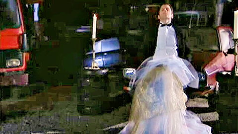 Laure Sainclair in flowing white gown, dramatic pose, Illusions (II) 1998