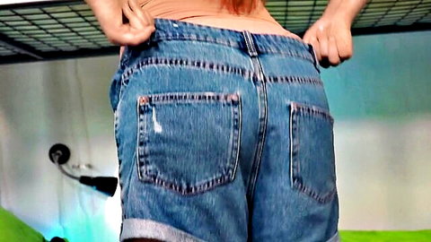 Ginebra Bellucci teasing with low-rise denim shorts, bare back view