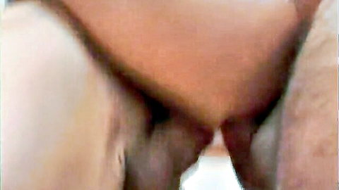 Close-up of thick veiny cock penetrating spread wet pussy lips with pubic hair.