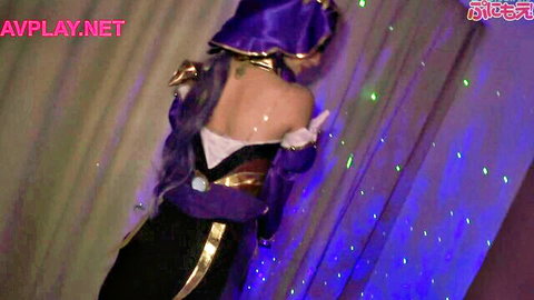 Japanese cosplayer in sexy purple cosplay dress posing from behind