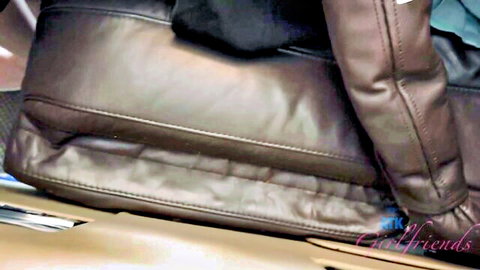 Elsa Jean in leather outfit on luxury car seat
