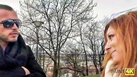 Handsome man in sunglasses seduces smiling redhead woman on park bench, Hunt4K cheating scene