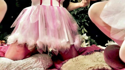 Two sexy teens in pink feathered tutu skirts pleasing each other with toys