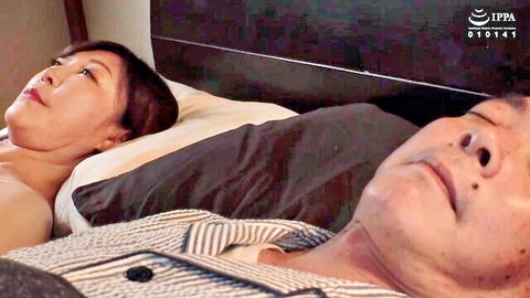 Asian MILF and stepson lying relaxed in bed after creampie session