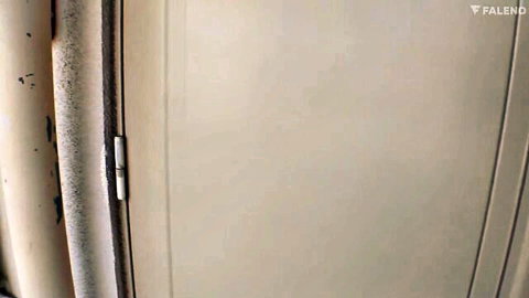 Big-titty Japanese neighbor peeking through ajar door in JAV tease