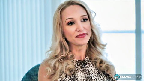 Blonde MILF smiling seductively in animal print top during adult interview