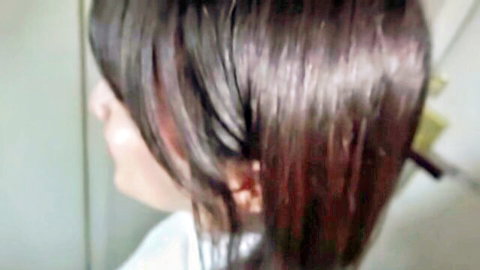 Petite Japanese brunette teen side profile with long straight hair and soft lips