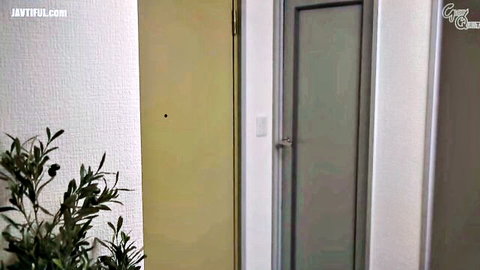 Indoor hallway doors and plant in teasing adult video preview