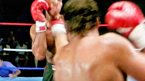 Two muscular men boxing intensely in ring, 1989 Kickboxer style fight scene