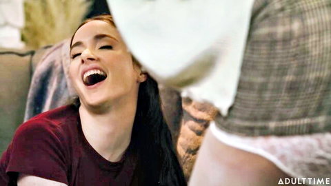 Hazel Moore laughs playfully in red top with Ryan Keely in nanny scene