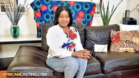 Curvy ebony woman in casual blouse and jeans at African casting couch