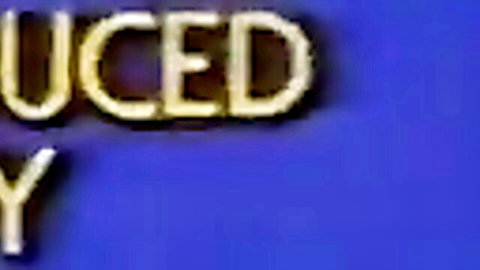 Blonde MILF with glasses deepthroats thick black dildo in retro porn
