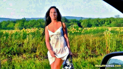Curvy Bettina DiCapri in sexy white sundress teasing outdoors
