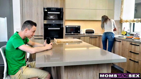 Blonde MILF Nikki Benz in tight jeans teases stepson in kitchen POV
