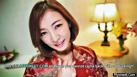 Seductive Japanese woman in red kimono smiling teasingly at camera for hot fuck
