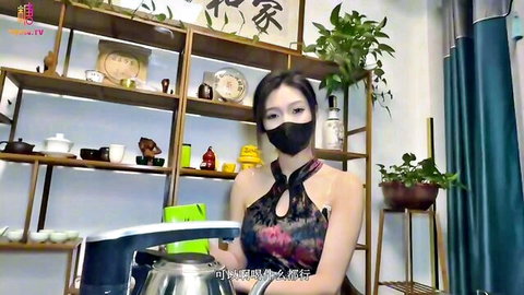 Asian big-tits tea girl in revealing halter top with cleavage