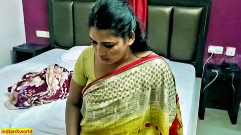 Desi Bhabhi Tabinash in yellow saree, seductive pose with big tits visible