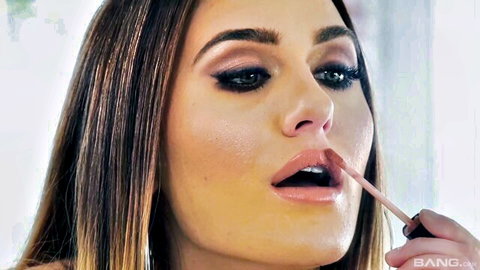 Seductive brunette teen licks pink lipstick teasingly like sucking cock
