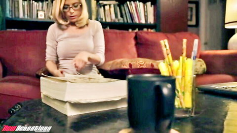 Emma Marx in glasses handling book in submission scene, blonde model