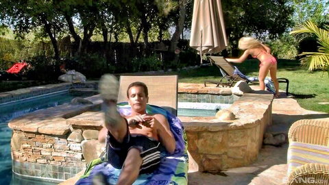 Emily Austin in pink bikini teases man by pool in seductive outdoor scene