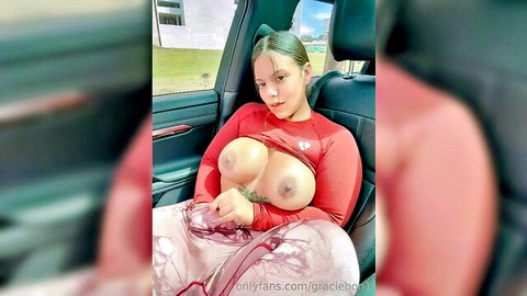 Busty babe exposes massive bare tits and nipples in car seat outdoor tease