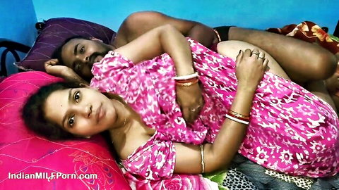 Desi Indian MILF in pink saree cuddling with husband on bed