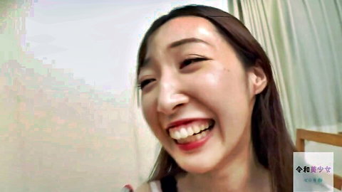 Smiling slender Asian woman with big breasts in JAV sister-in-law video
