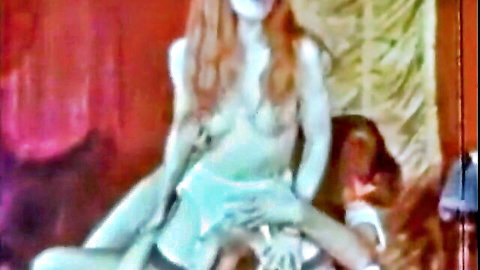 Retro redhead babe riding cock in vintage porn scene