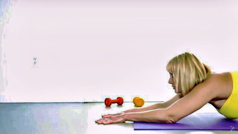 Tanned blonde PAWG with big ass and huge tits in tight yellow sports bra doing yoga stretch on gym mat