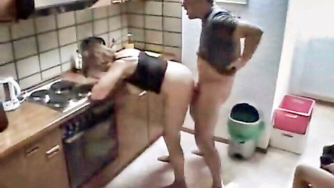 Blonde bent over kitchen counter with bare ass and pussy as naked man grips hips with hard cock ready to fuck.