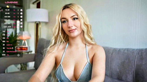 Blonde cam model Catch_Me in low-cut blue dress showing cleavage