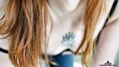 Redheaded Canadian tgirl with intricate chest tattoo in black lingerie