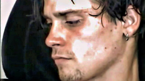 Straight boy TJ with wet curly hair and hoodie, seductive profile view