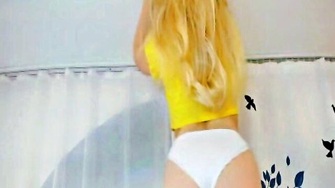 Blonde babe in yellow top and white panties bending over teasingly