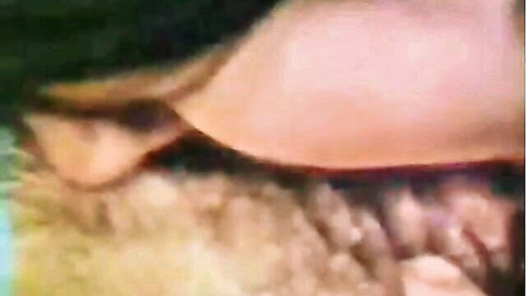 Close-up of blonde woman's blue eyes and makeup in classic O.Z. Films porn thumbnail