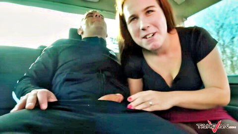 Redhead MILF seducing man in van, cleavage and skirt tease