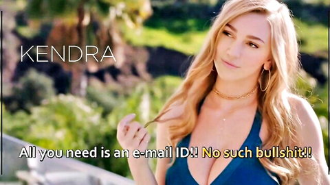 Kendra Sunderland in low-cut blue dress showing cleavage outdoors