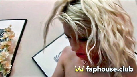 Blonde model topless in seductive photoshoot session