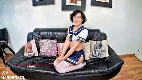 Ariane Kimiko in sexy schoolgirl uniform, teasing pose