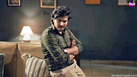 Handsome Indian man in checkered shirt sitting seriously in Fevicool Hindi MILF sex series Ep 1