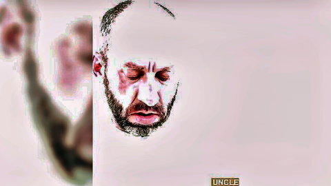 Intense blurred portrait of bearded bald hunk Aaron Allen in gay threesome video