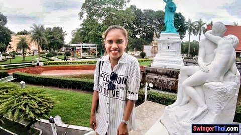 Smiling Thai bubble butt girlfriend in park outing, striped shirt