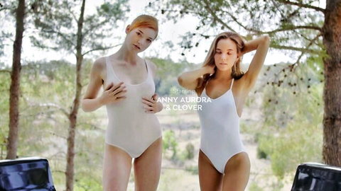 Anny Aurora and Clover posing in white swimsuits outdoors
