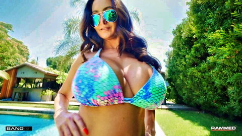 Ava Addams in colorful bikini teasing by pool with big tits