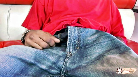 Asian man in red shirt grips erect cock through open jeans