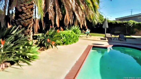 Remy LaCroix lounging poolside in sunny outdoor tease